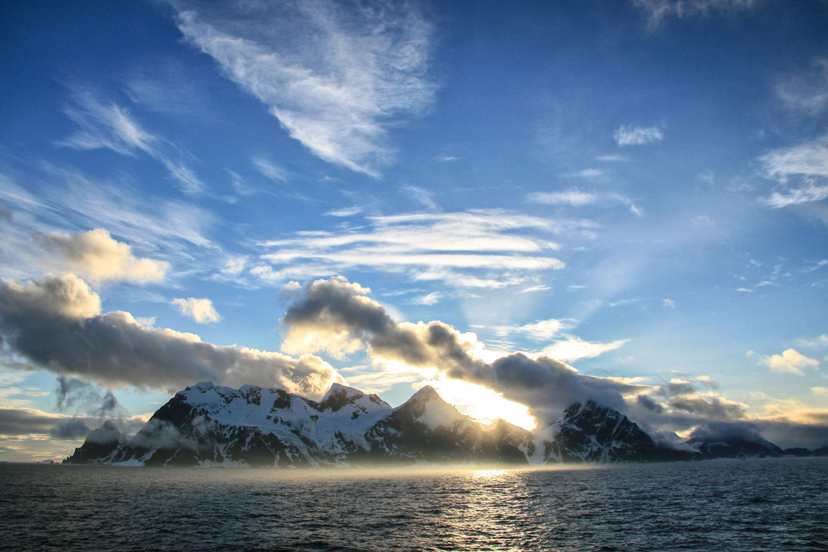 sun view and snowy rocky mountains at Elephant Island