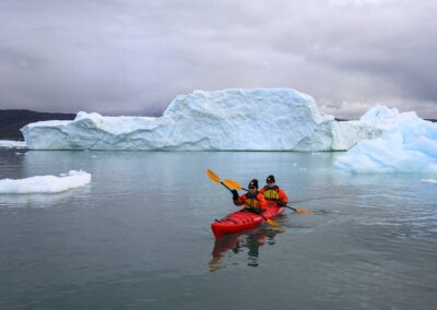 A Kayak in front of iceberg in Greenland