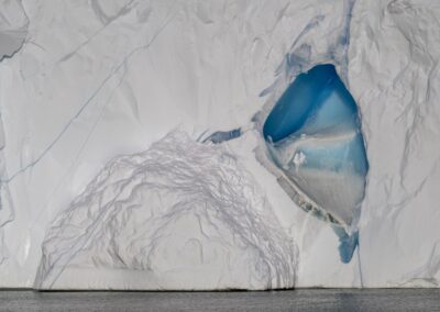 Big white iceberg with interesting blue colour