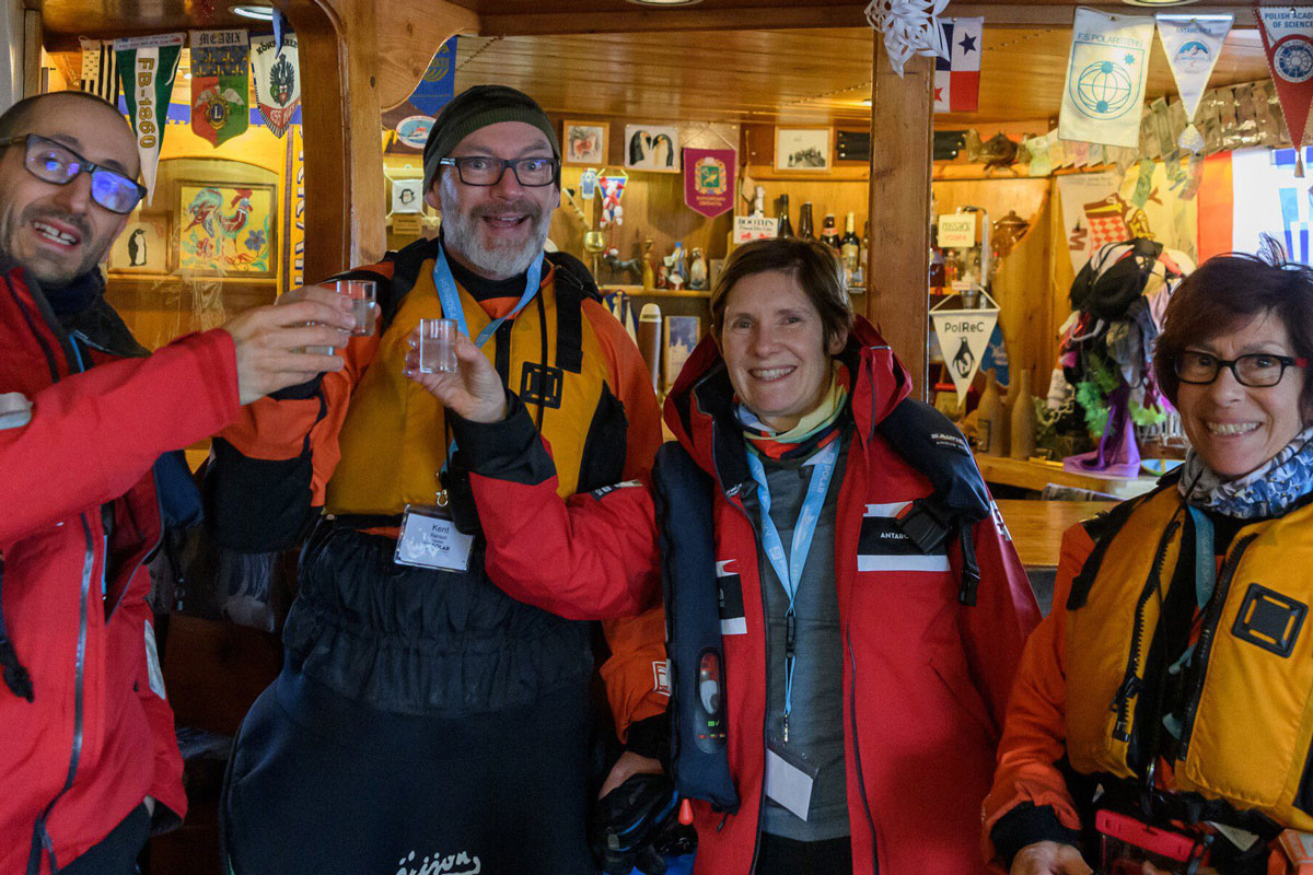 PL-Crossing-the-Antarctic-Circle-Expedition-Yalour-Is-and-Vernadsky-Station Visitors enjoying a drink at the Vernadsky Station bar in Antarctica