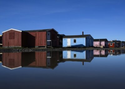 Greenlandic colourful houses mirroring in water