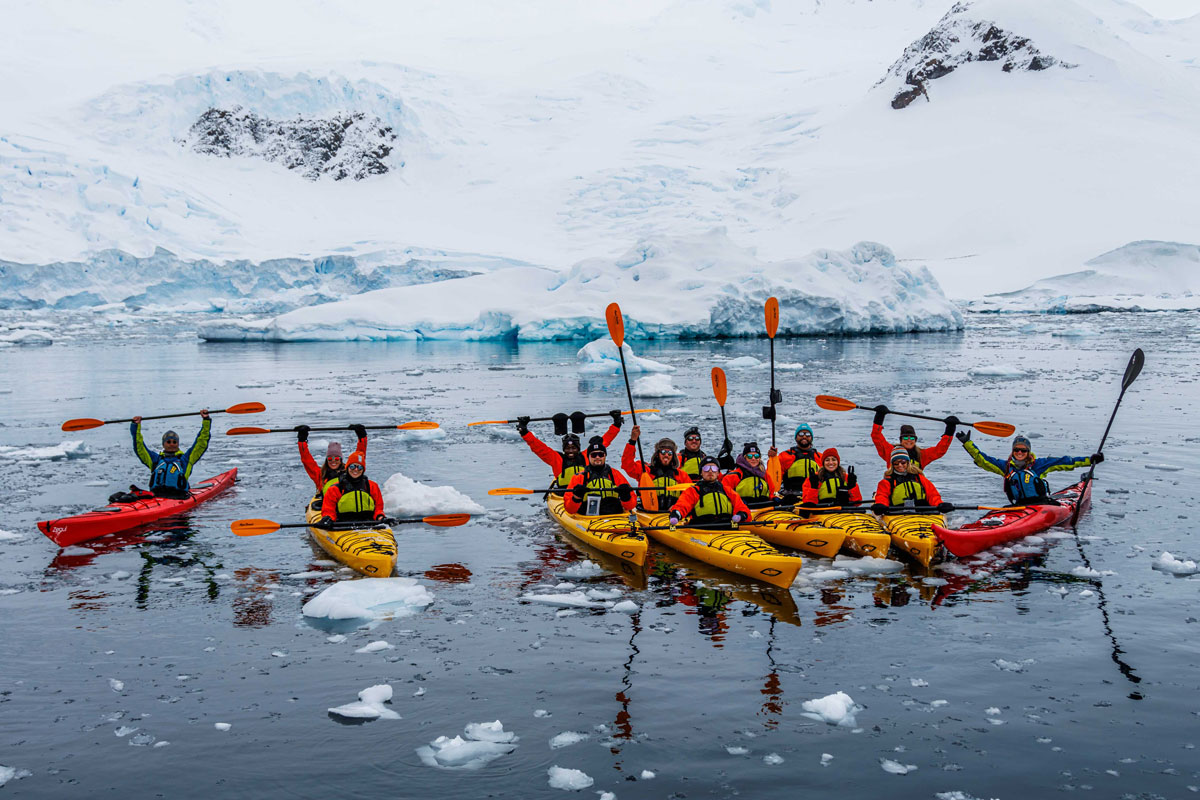kayaking-neko-harbour Panoramic view of Neko Harbour with calving glacier and Gentoo penguins